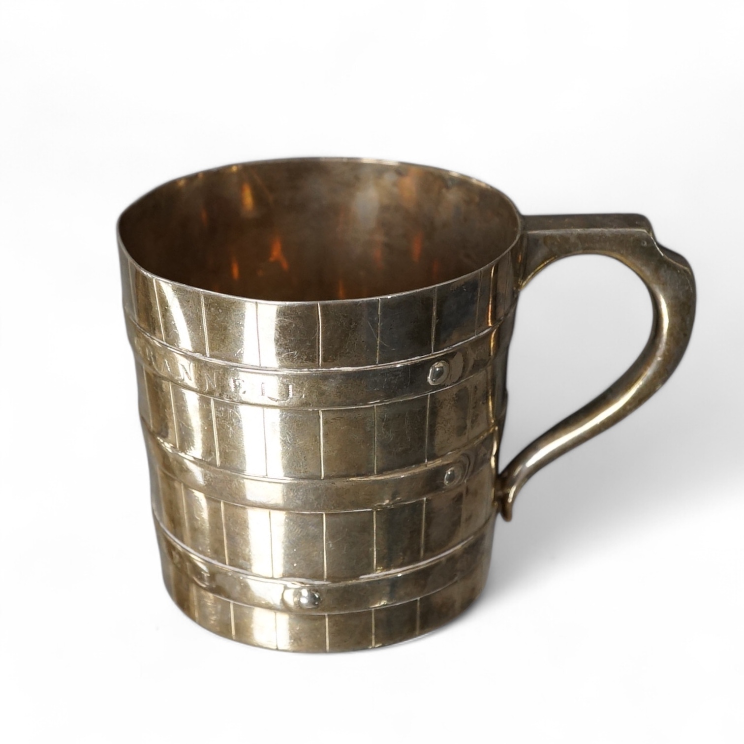 A Victorian Scottish silver mug, of half barrel form, with engraved inscription, Edwin Millidge, Edinburgh, 1875, height 65mm, 5.3oz. Condition - poor to fair